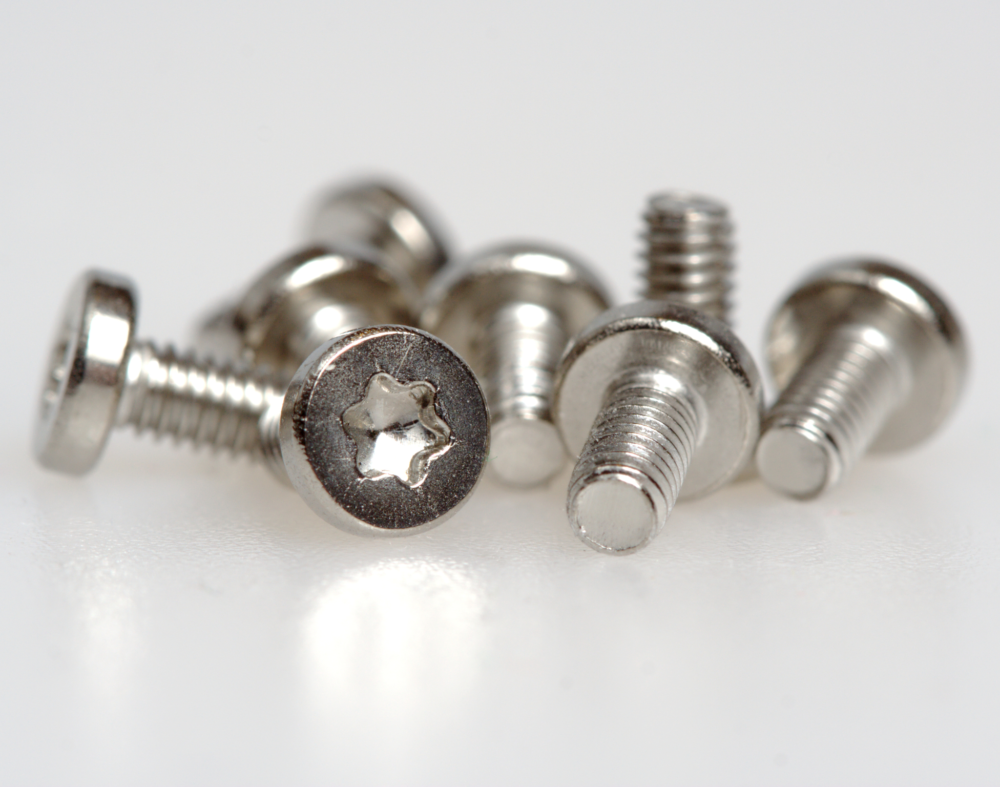 Close-up of several small Torx screws