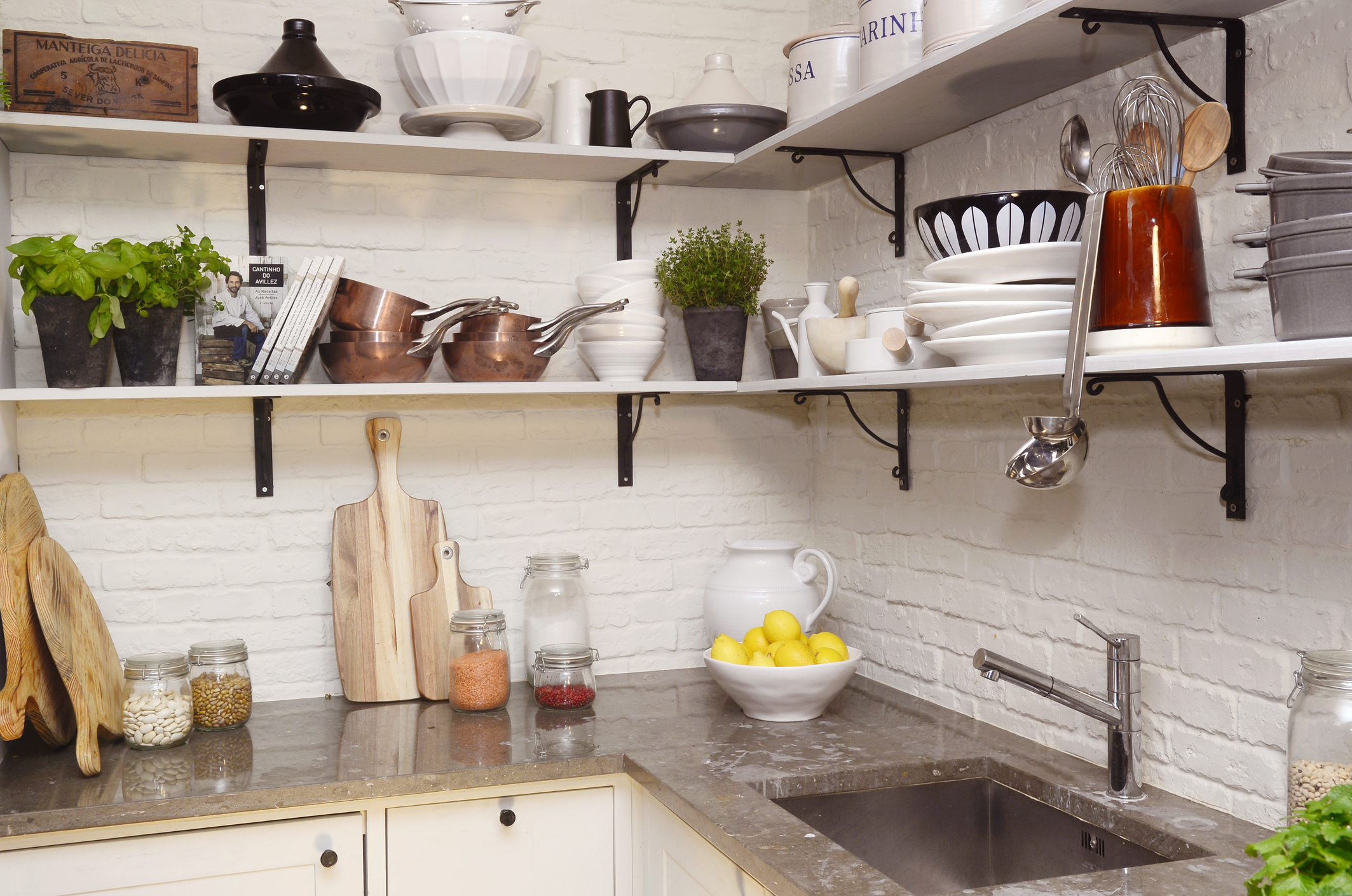 Charming White Kitchen with Colorful Fruits on Granite Counter